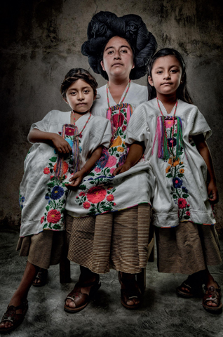 Previously a garment worn daily by young unmarried women, the embroidered huipil of Villa Hildago Yalalag is now strictly formal occasion dress for the women of the village. On Mondays, however, girls are required to wear them to school. The braided tassel at the neckline of the Yalalag huipil is a traditional element that predates the Spanish invasion.