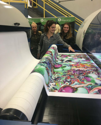 students watching fabric being printed