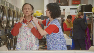 still from The Washing Society with two laundry employees
