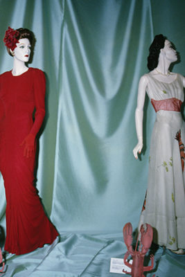 Installation view of Fashion & Surrealism (1987) featuring La Sirène dress by Charles James and "Lobster" dress by Elsa Schiaparelli and Salvador Dalí