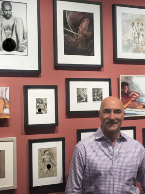 Ron Amato standing in a gallery