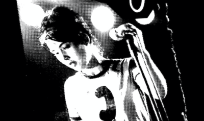 Kathleen Hanna at a microphone during a concert