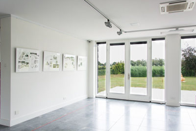 Gallery view with doors to outside space