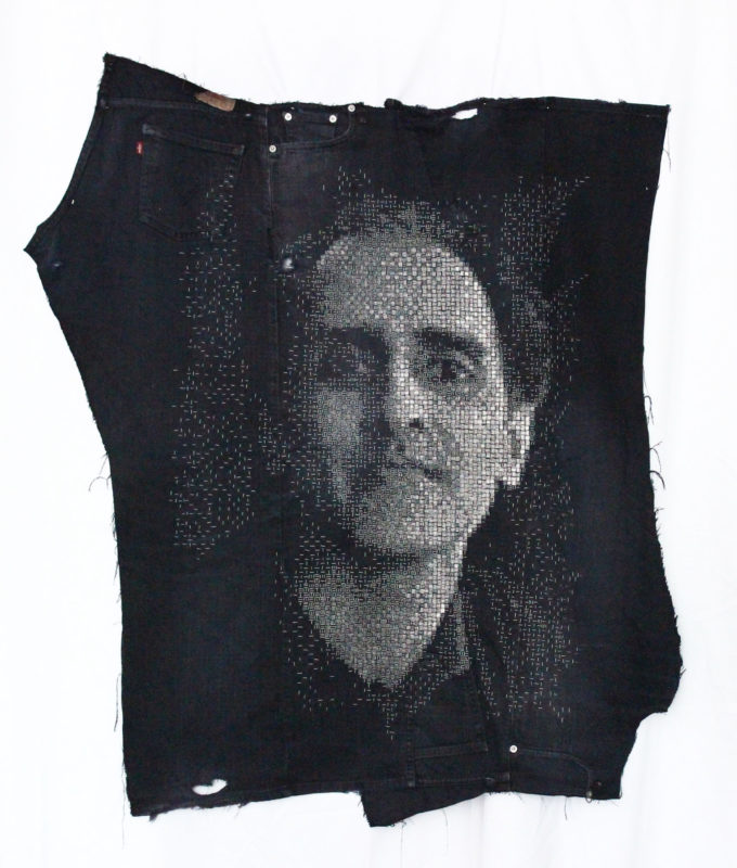 Portrait of Max on His Jeans by Hallie Meltzer, recycled denim stitched with loom waste, 41 by 36 inches, 2018.