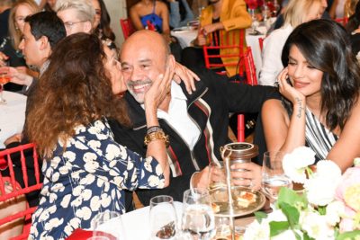 Christian Louboutin being kissed by Diane von Furstenburg at the Couture Council Luncheon