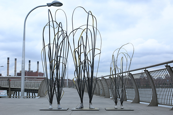 sculptures with feet made of looped metal