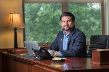 Dr. Jim Malatras at his desk at Empire State College