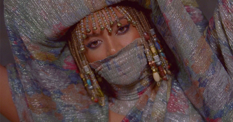 Closeup of Beyonce wearing an Egyptian-inspired outfit