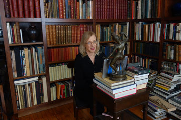 Valerie Steele at home in front of her bookcases