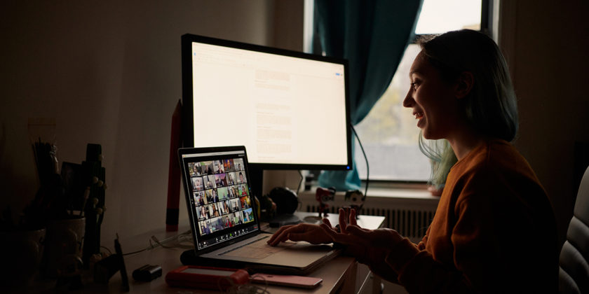Student studying remotely in dark room