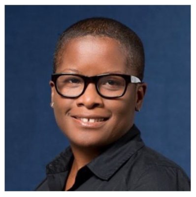 Headshot of Black woman with short hair and eyeglasses