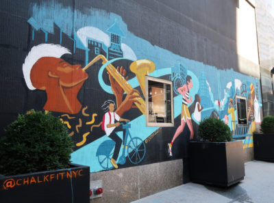 Mural of saxophone player, runner, and others