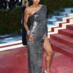 Ciara wearing a silver off-the-shoulder gown with a thigh slit