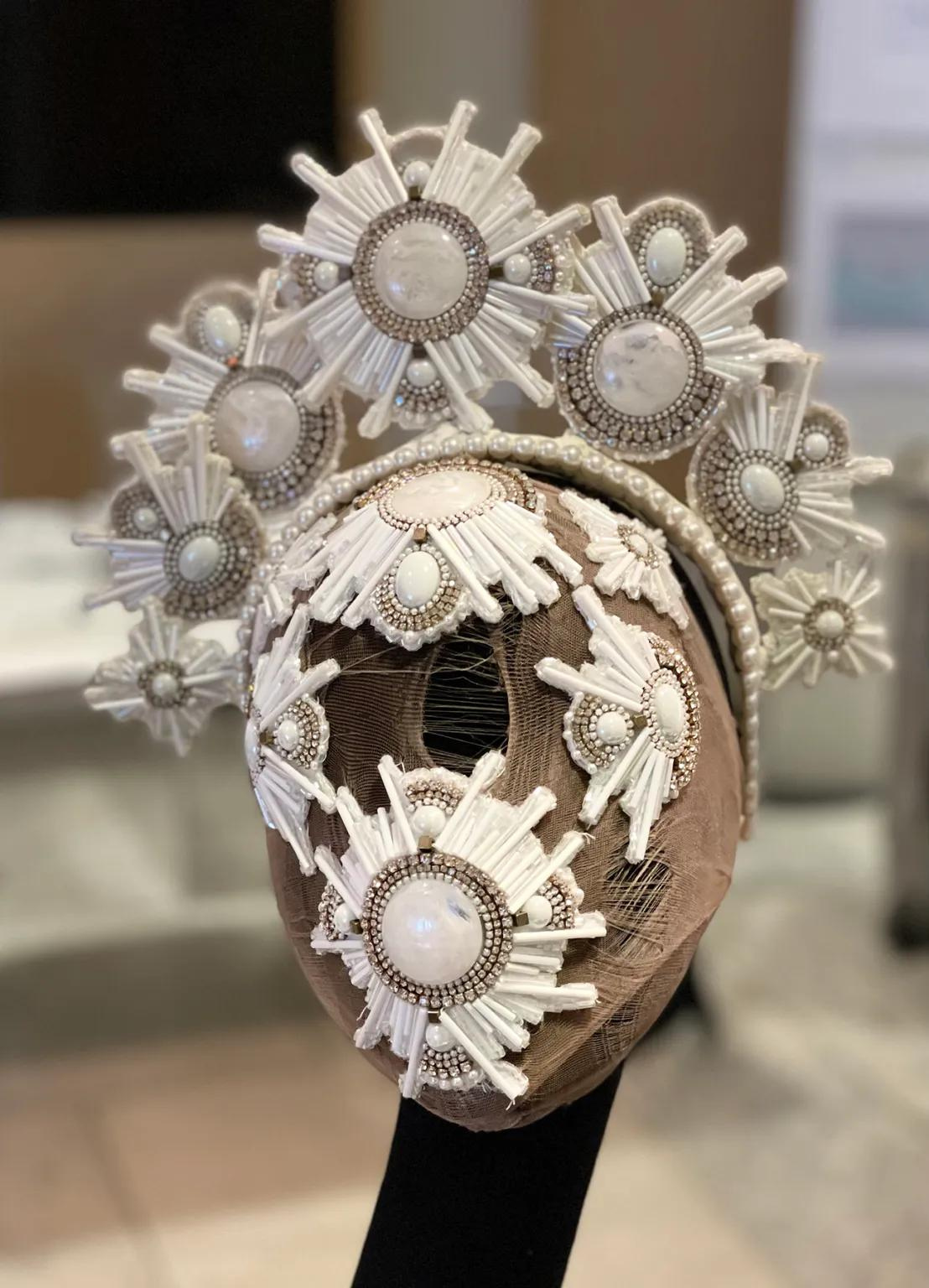 headress of white starbursts designed by Jess Roe