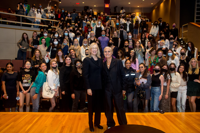 Valerie Steele and Maria Grazia Chiuri on stage at FIT with an audience of students behind them