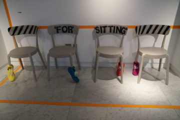 chairs displaying shoes on the legs