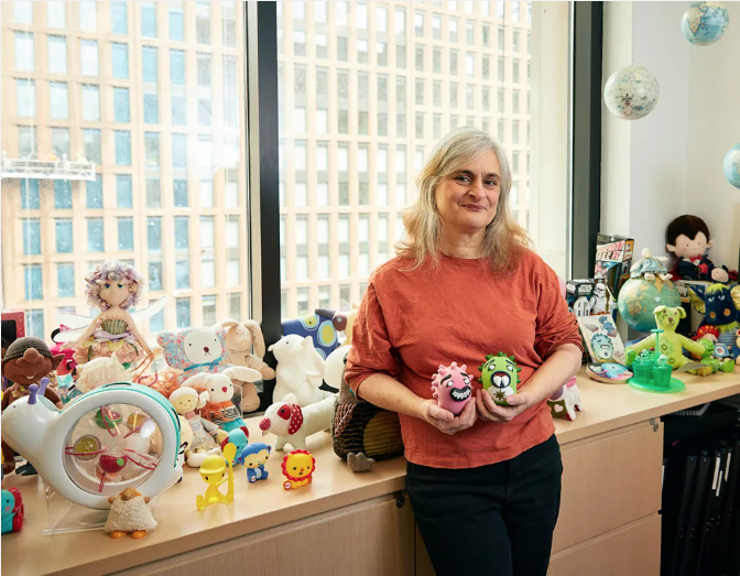 Susan Adamo Baumbach in her office with toys