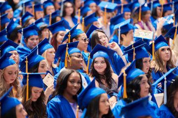 Graduates standing in Central