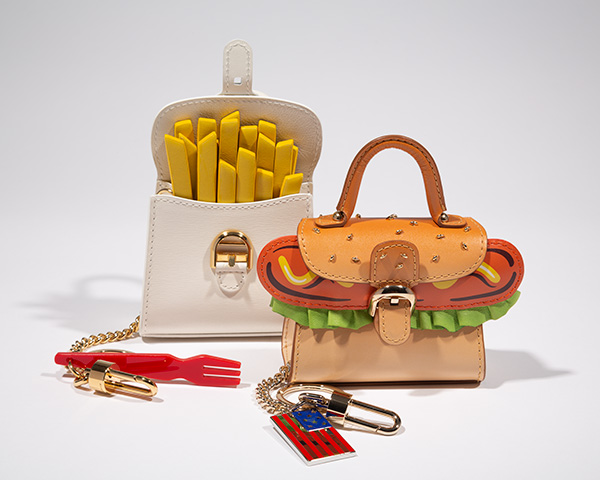 two purses that look like a box of french fries and a hamburger on a bun