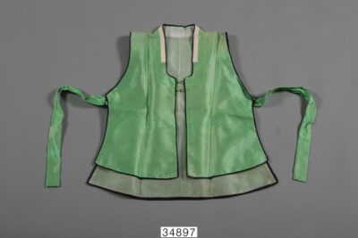 green baeja vest with fabric ties under the arms