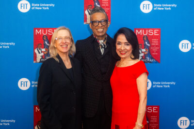 Valerie Steele, director and chief curator of The Museum at FIT; B Michael; and President Joyce F. Brown in front of a step and repeat.