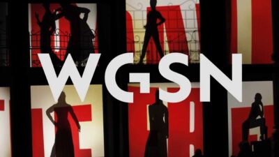 WGSN logo on background with models posing on two tiered runway