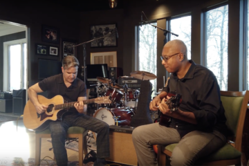 Gil Parris and Bernie Williams playing guitar