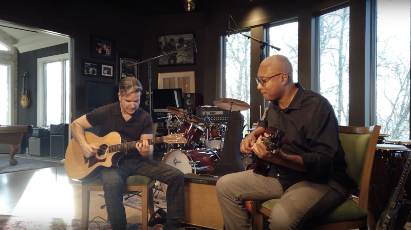 Gil Parris and Bernie Williams playing guitar