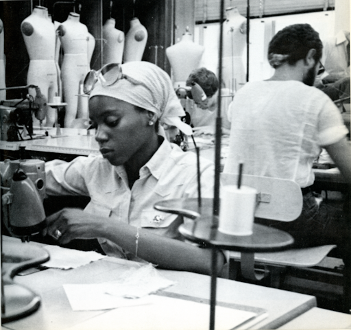 two garment workers in the 1970s at industrial sewing machines