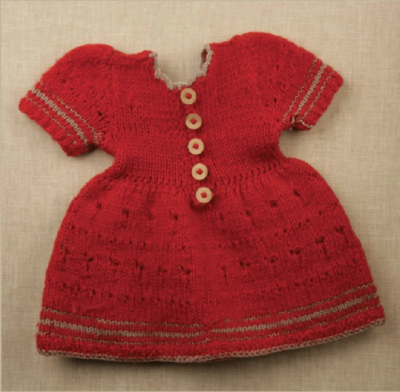 Child's dress knitted with red yarn and gray edging and details, by Mary Frankenstein, ca. 1941.