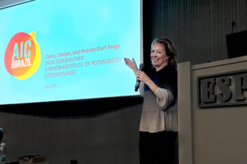 Jada Schumacher points to a screen during her presentation at a conference