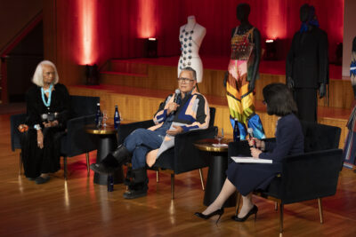 Amy Denet Deal with Renee Hunter and President Joyce F. Brown on stage at the Katie Murphy Amphitheatre