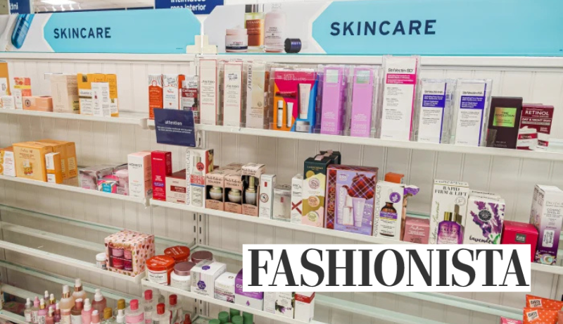 drugstore shelves with skincare products; Fashionista logo