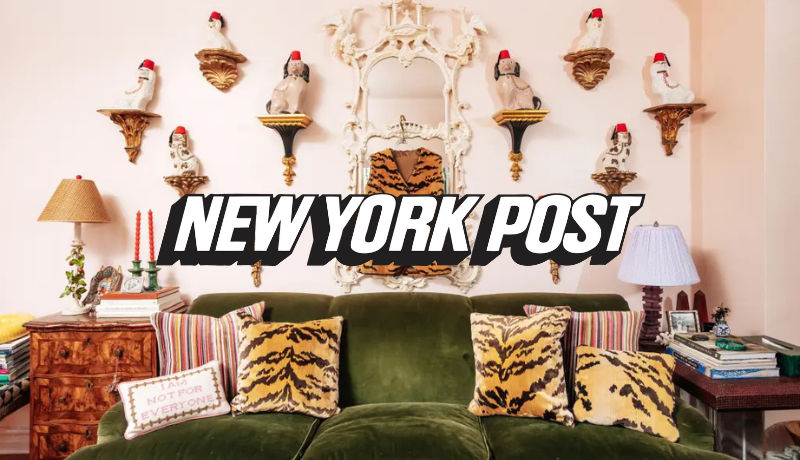 green velvet couch with tiger print pillows surrounded by shelves with ceramic dogs with fez hats; New York Post logo