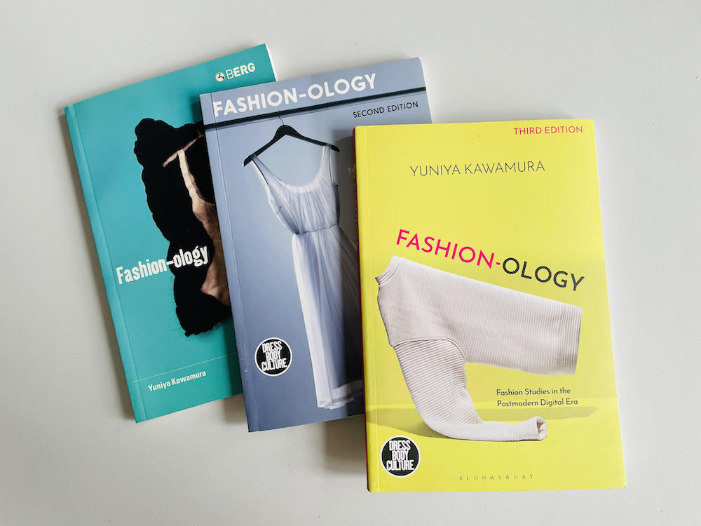 three editions of the book Fashion-ology as it has been reprinted over time