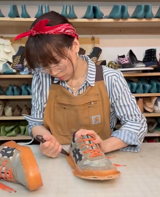 Sungwoo Roh upcycling sneakers in her workshop