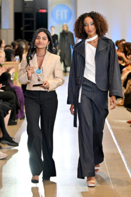 Designer Athmiha Saravanen and a model walk the runway
