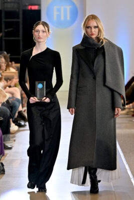The designer and a model walk the runway during the FIT's 2026 Future of Fashion runway show