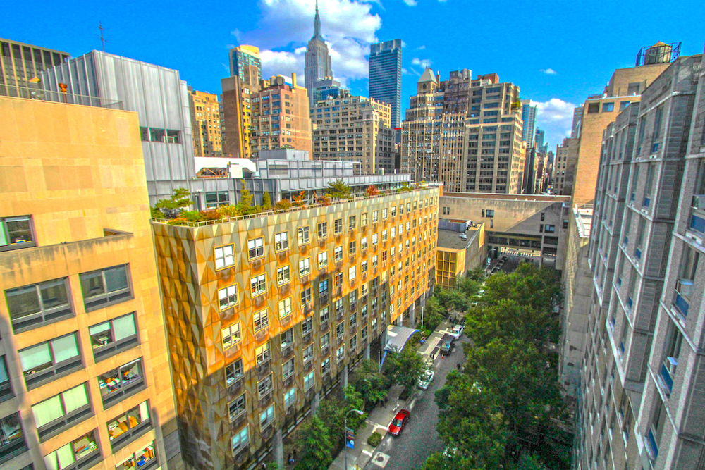 view of FIT campus with NYC skyline behind, showing the Empire State Building