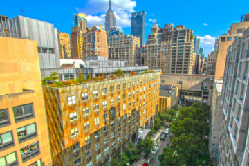 view of FIT campus with NYC skyline behind, showing the Empire State Building