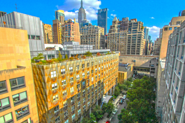 view of FIT campus with NYC skyline behind, showing the Empire State Building