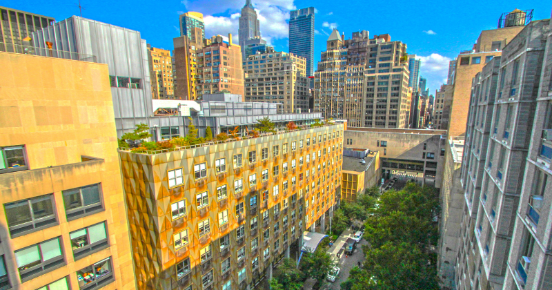 view of FIT campus with NYC skyline behind, showing the Empire State Building