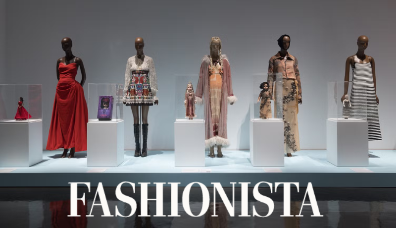 exhibition view of Doll Dressing; Fashionista logo