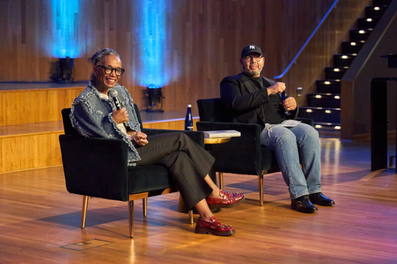 Journalist Robin Givhan smiling on the left; writer Emil Wilbekin on the right.